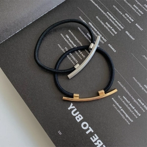 Minimalist elastic hair ties with polished gold and silver metal geometric accents