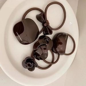 Brown hair ties set featuring resin flower and bow designs in French minimalist style