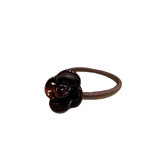 Deep brown camellia flower elastic hair tie with tortoiseshell finish and high gloss
