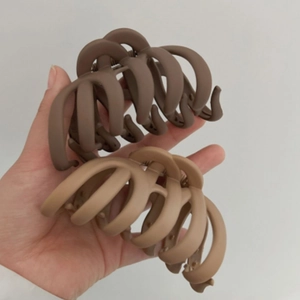 Matte brown and khaki large hair claw clips for women with elegant curved shark clip design