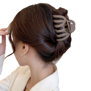 Elegant mocha brown matte claw clip for women's thick hair in a stylish updo style