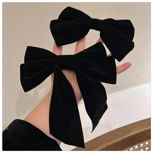 Elegant black velvet bow hair clips set for women in a vintage retro luxury style
