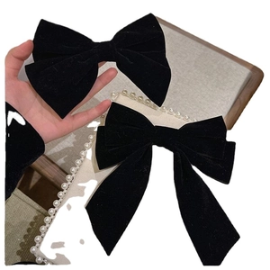 Elegant black velvet bow hair clip set with horizontal and long tail designs for women