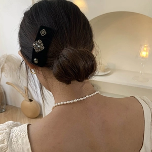 Baroque black velvet hair clip with crystals shown on hair for a vintage styling look