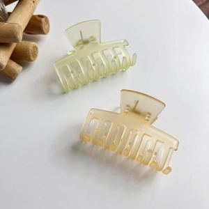 Frosted jelly color hair claw clips in light green and amber with matte texture