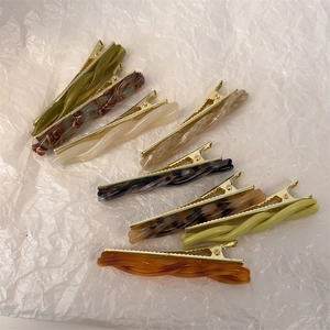 Set of 8 spiral twisted acetate hair clips in assorted marble and tortoise patterns