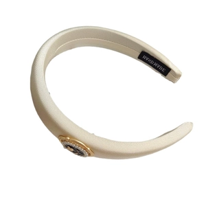 Elegant cream satin headband featuring vintage floral cameo and pearl embellishments