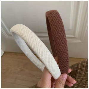 Detailed knit texture and sponge padding of beige and brown non-slip French headbands