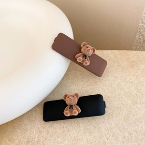 Plush bear hair clips in brown and black with matte finish for women and girls