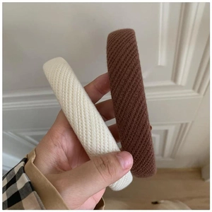 Chic padded sponge headbands in cream and brown knit fabric for a high-volume hair look