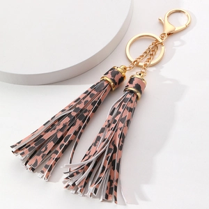 Leopard print tassel keychain with dual coral pink leather fringe and gold metal ring