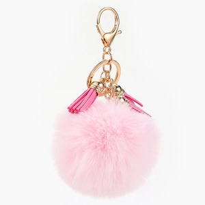 Porte-clés pompon rose en fausse fourrure avec fermoir doré et glands élégants
