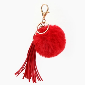 Red faux fur pompom keychain with long leather tassel and gold lobster clasp