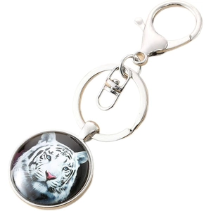 Silver metal keychain with round white tiger glass pendant and large lobster clasp