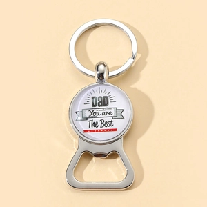 Close-up of Father's Day silver bottle opener keychain with 'DAD You are The Best' text