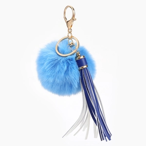 Sky blue faux fox fur pompom keychain with blue and white tassel and gold lobster clasp