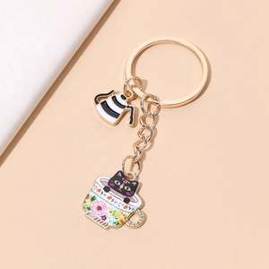 Cute cartoon teacup cat keychain with enamel coffee cup and black cat pendant ornament
