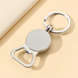 Close-up of a silver metal bottle opener keychain with textured grip for Father's Day gifts
