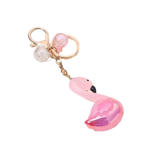 Porte-clés flamant rose en résine avec anneau or rose et breloques boules pailletées
