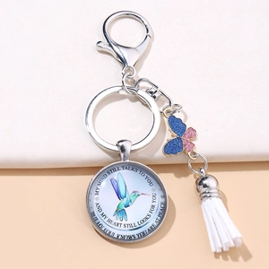 Hummingbird glass gem keychain with glittery butterfly and soft white tassel decoration