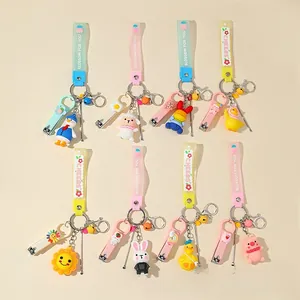 Cartoon themed nail clipper keychain set with silicone wrist strap and small bell charms