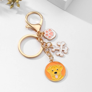 Porte-clés chien Golden Retriever avec pendentifs en forme d'os et de patte dorés