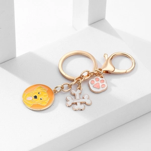 Porte-clés chien Golden Retriever de dessin animé avec pendentifs os et patte