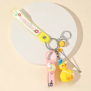 Macro shot of yellow duck keychain set with nail clipper, ear pick and cheers strap