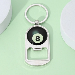 Macro detail of polished metal number 8 billiards keychain with integrated bottle opener