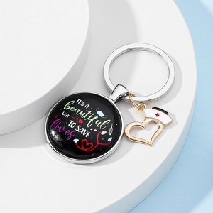 Detail of nurse theme keychain with 'IT'S A beautiful DAY TO SAVE lives' text and medical icons