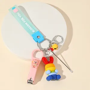 Pink cartoon bear nail clipper keychain with colorful rabbit charm and blue wrist strap