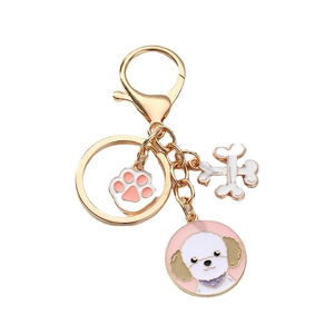 Porte-clés chien mignon avec breloques patte et os en métal doré brillant