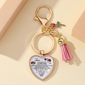 Golden heart keychain for Mother's Day with pink tassel and floral quote charm