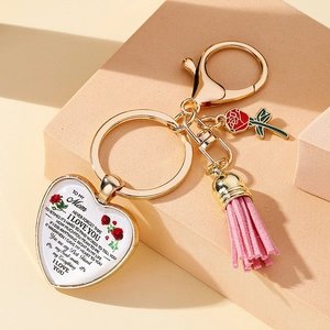 Detail of Mom heart pendant keychain with red rose charm and pink tassel gift