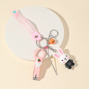 Pink cartoon bunny keychain set with folding nail clipper, ear pick and charm