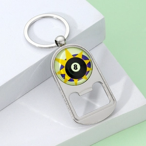 Close-up of polished silver metal keychain bottle opener with black 8 billiard design