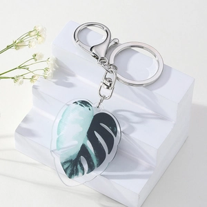 Translucent acrylic Monstera leaf keychain with silver metal lobster clasp and ring