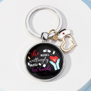 Nurse appreciation keychain with nurse hat charm and inspirational message on black round pendant