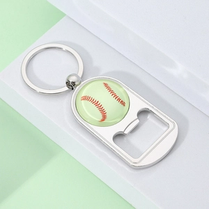 Close-up of baseball-themed metal keychain bottle opener on white display stand