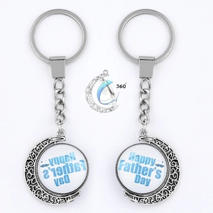 Silver metal rotating moon keychain with Happy Father's Day blue gemstone pendant