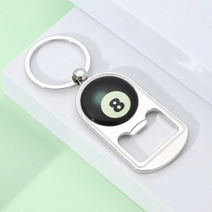Close-up of metal bottle opener keychain with black number 8 pool ball design
