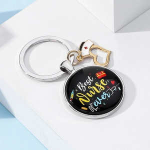 Detail of metal nurse keychain with Best Nurse ever text and medical icons charms