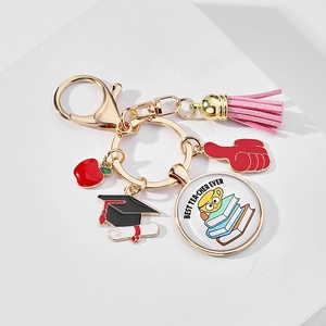 Detail of Best Teacher Ever keychain with red apple, graduation cap, and leather tassel