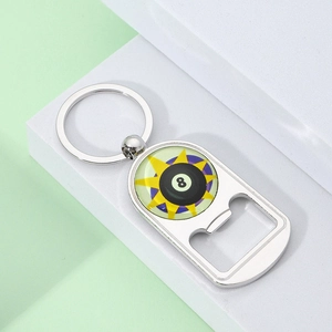 Detail of 8-ball billiard bottle opener keychain with glossy resin finish on green steps