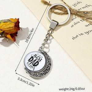 Rotating crescent moon keychain detail with the best dad in the world message