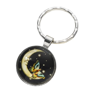 Vintage silver metal keychain with a celestial moon face and colorful butterfly design