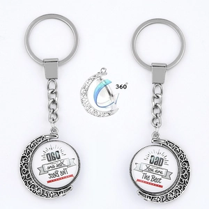 Detail view of 360-degree rotating Father's Day keychain with 'Dad You are The Best' engraving