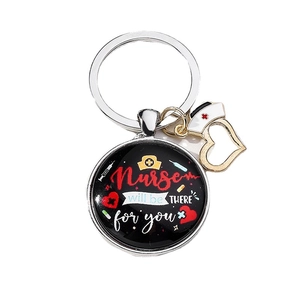 Nurse appreciation keychain with silver heart charm and round pendant on white background