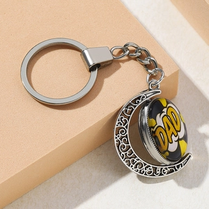 Detail of creative silver moon keychain with rotating DAD pendant for Father's Day gift