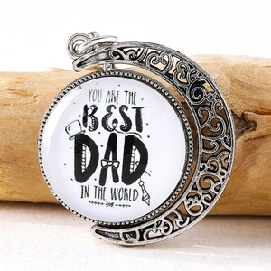 Detail of rotating crescent moon pendant with Best Dad In The World message and hat icon